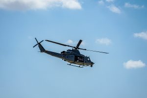 army-helicopter-hovering-on-a-blue-sky-background-helicopter-on