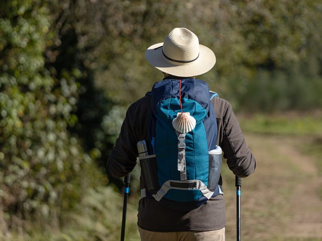 view-from-behind-of-a-pilgrim-walking-on-his-way-to-santiago-de